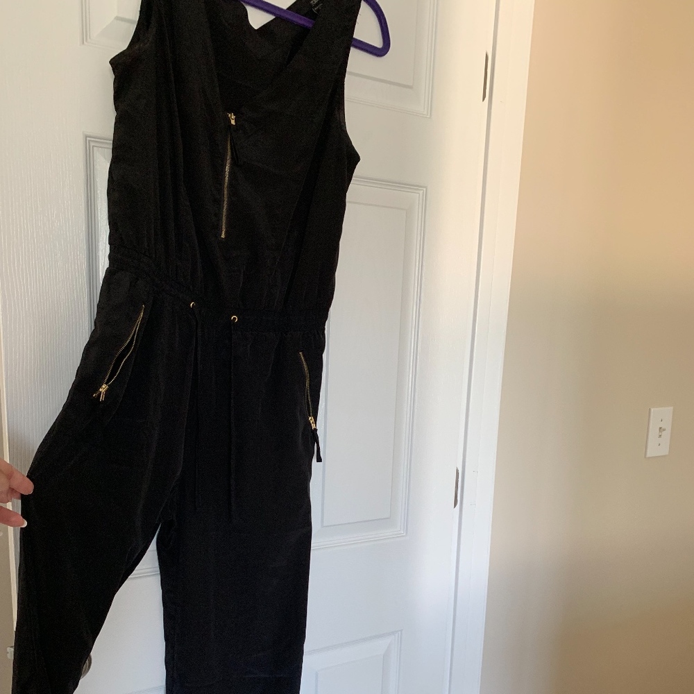 Black silk jumpsuit with gold accents